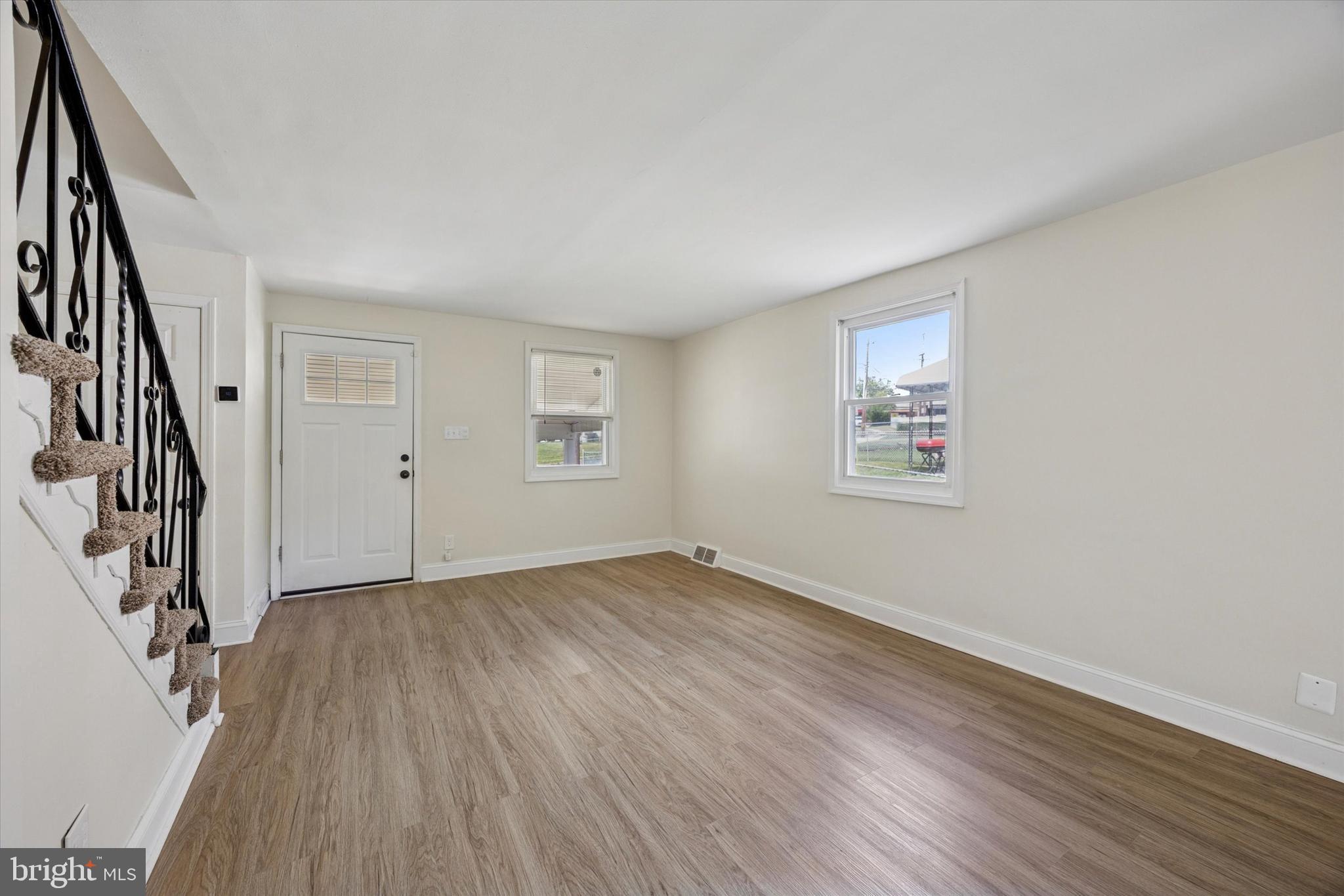 723 Bennington Road Folcroft, PA 19032 - Photo 5 of 25 wooden floor in an empty room with a window