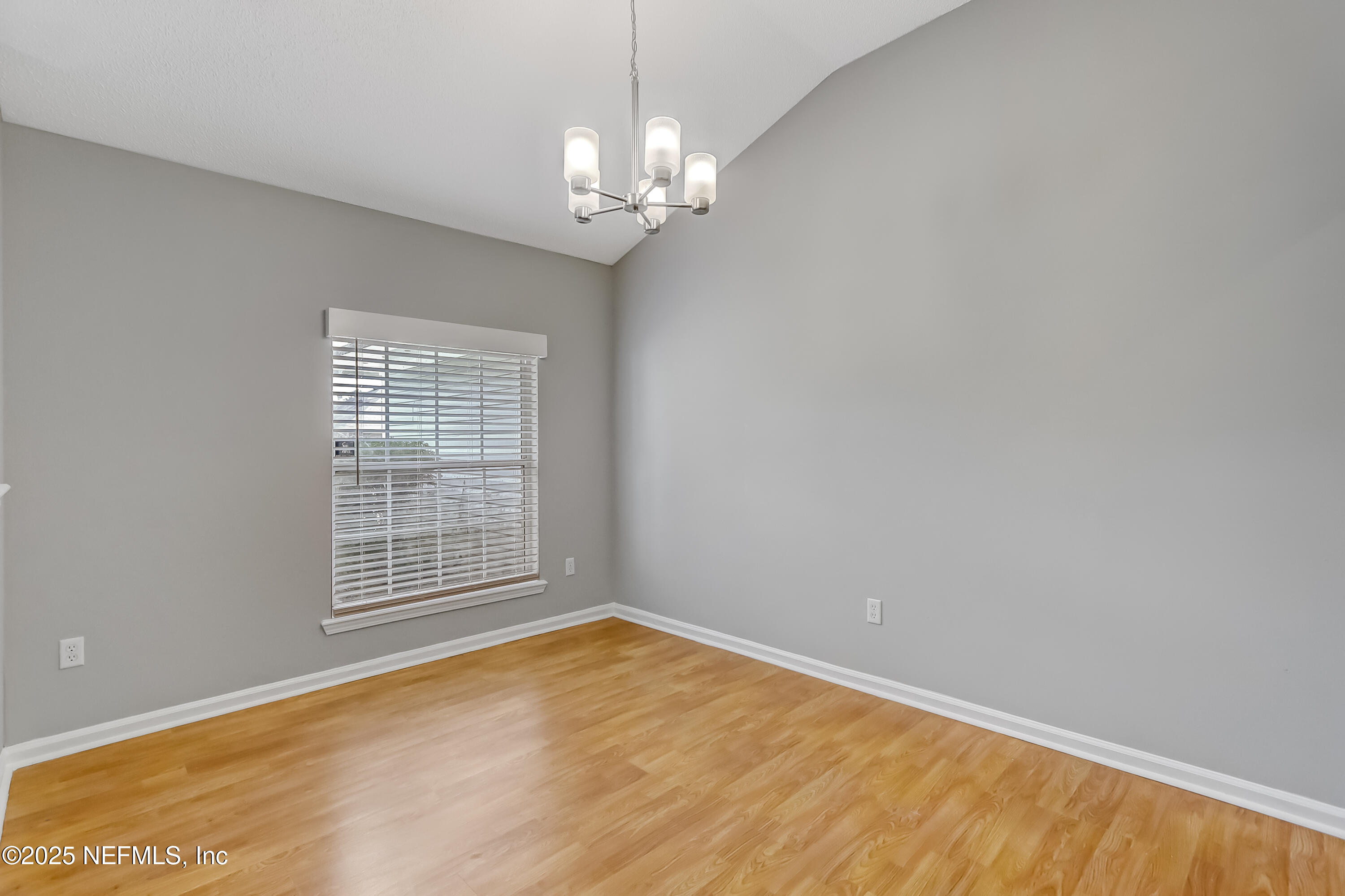 9642 Pritmore Road East Jacksonville, FL 32257 - Photo 14 of 47 wooden floor in an empty room with a window