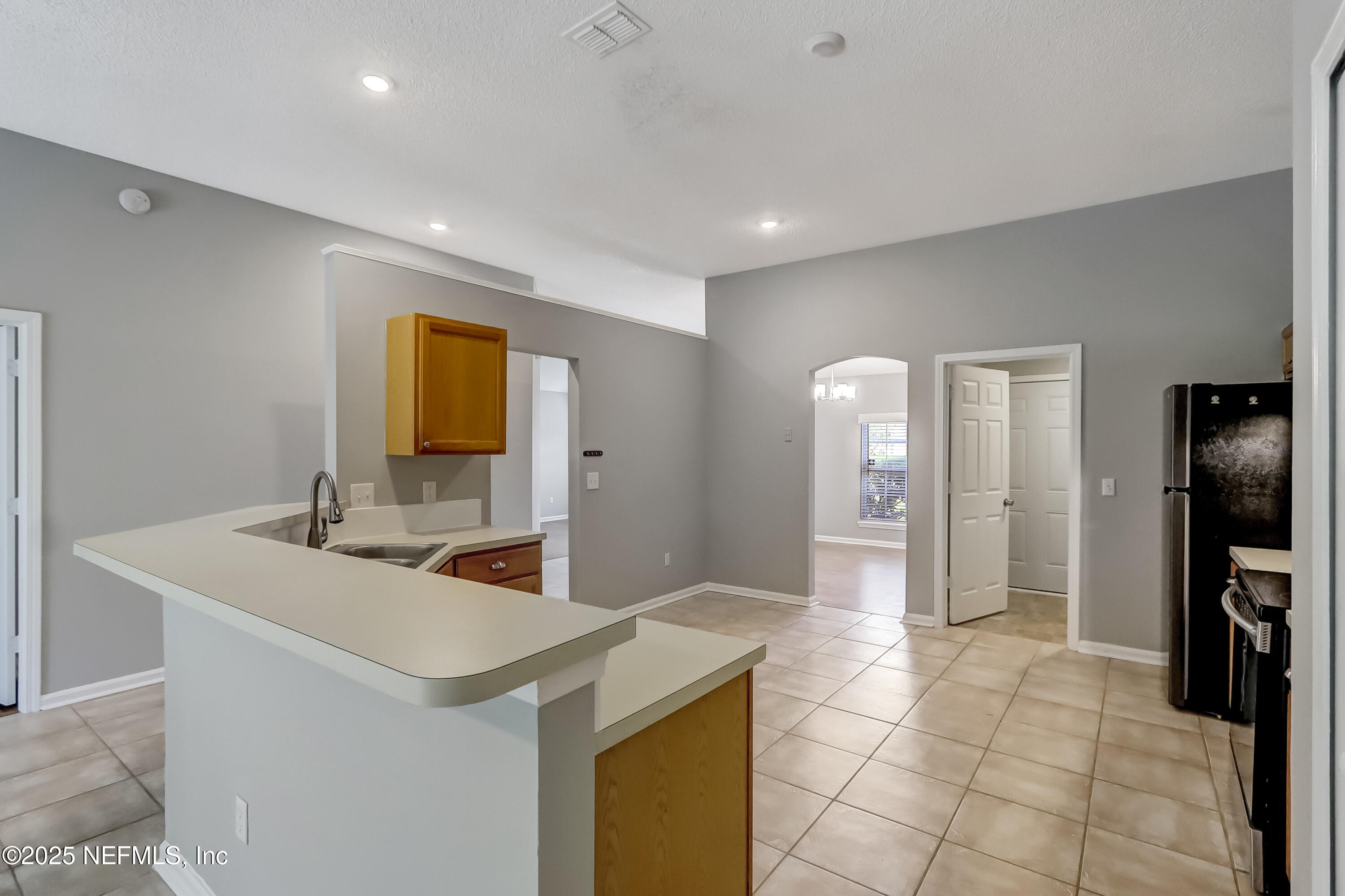 9642 Pritmore Road East Jacksonville, FL 32257 - Photo 24 of 47 a bathroom with a sink a toilet and a mirror