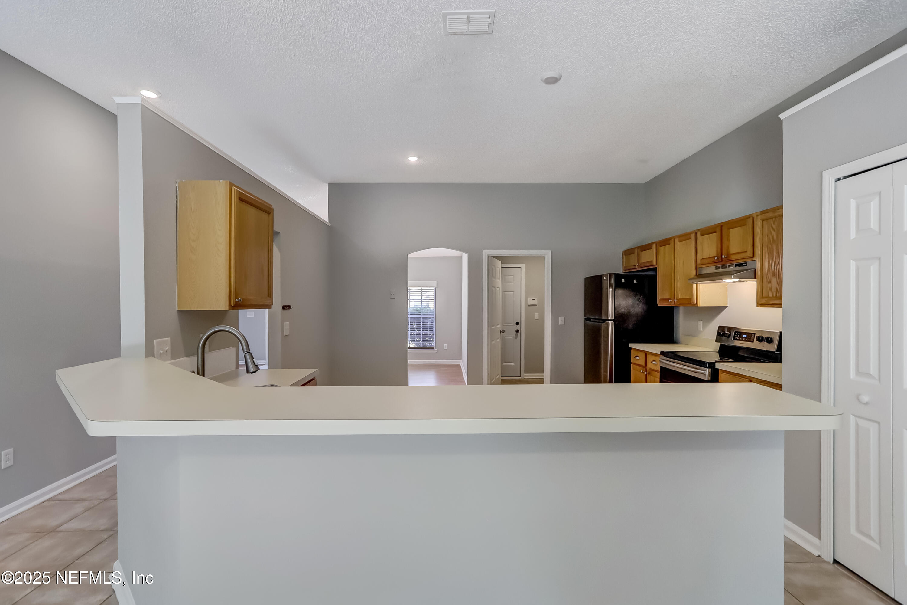 9642 Pritmore Road East Jacksonville, FL 32257 - Photo 25 of 47 a bathroom with a sink and a mirror