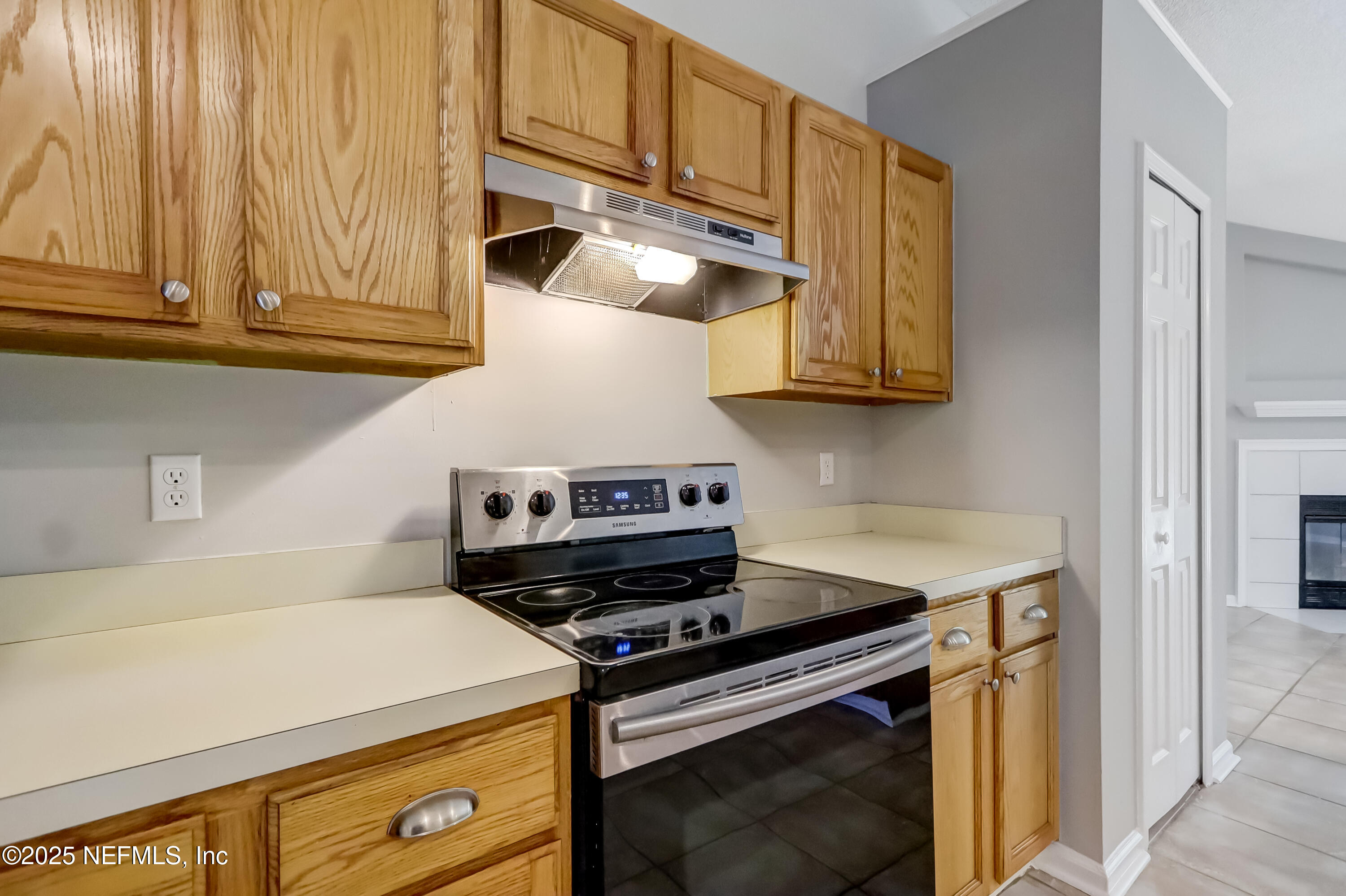 9642 Pritmore Road East Jacksonville, FL 32257 - Photo 28 of 47 a stove top oven sitting inside of a kitchen