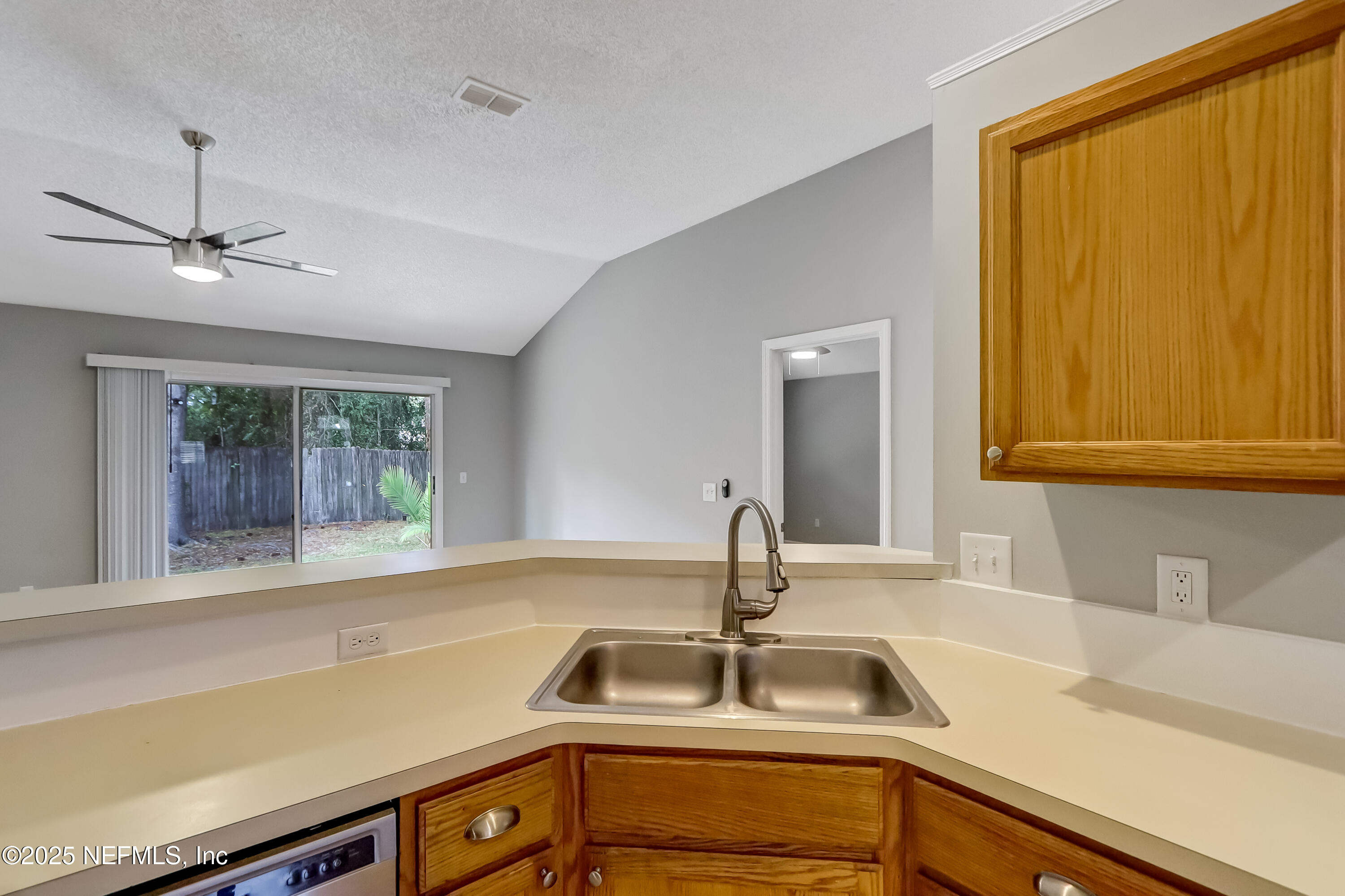 9642 Pritmore Road East Jacksonville, FL 32257 - Photo 29 of 47 a kitchen with a sink and a window