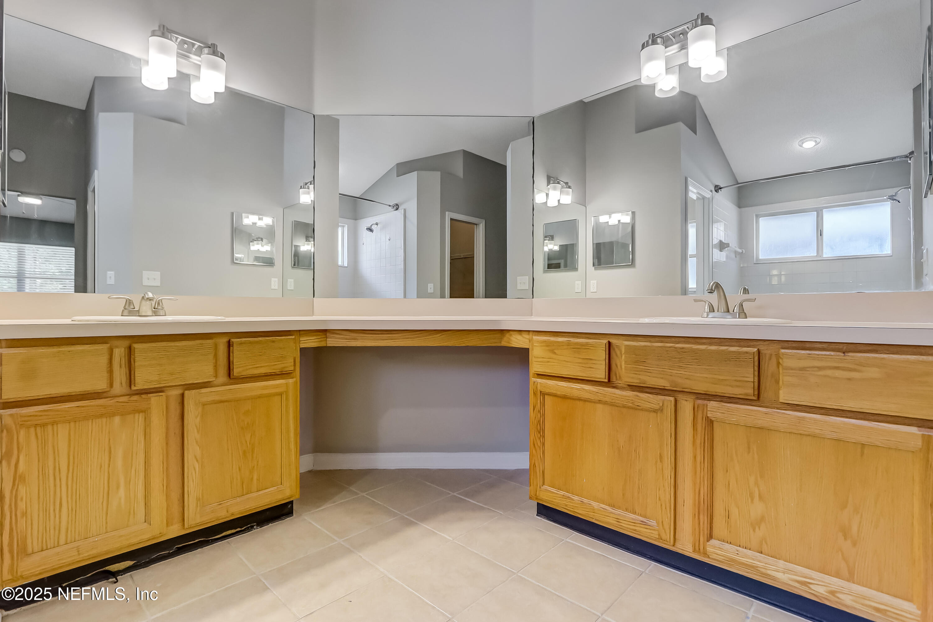 9642 Pritmore Road East Jacksonville, FL 32257 - Photo 33 of 47 a bathroom with a sink vanity and mirror