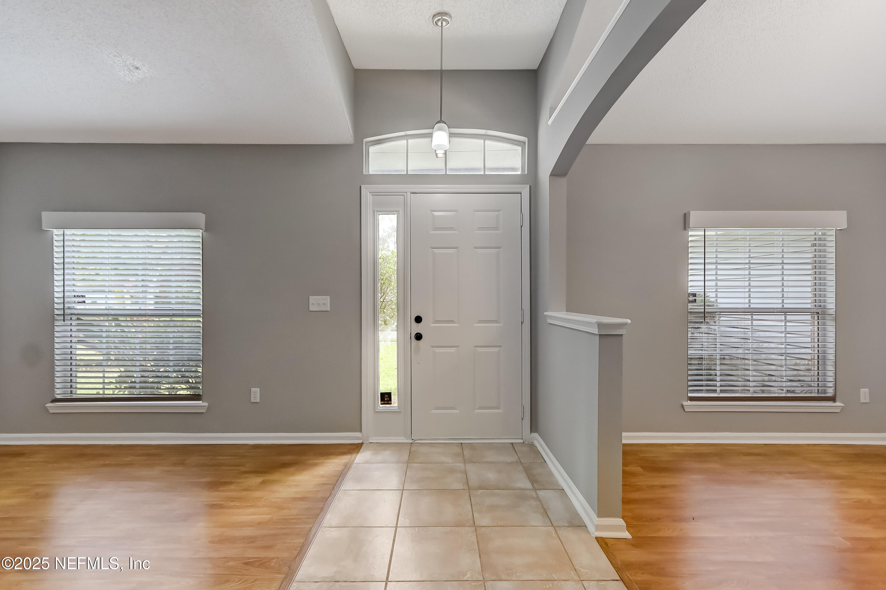 9642 Pritmore Road East Jacksonville, FL 32257 - Photo 8 of 47 a view of empty room with wooden floor and fan