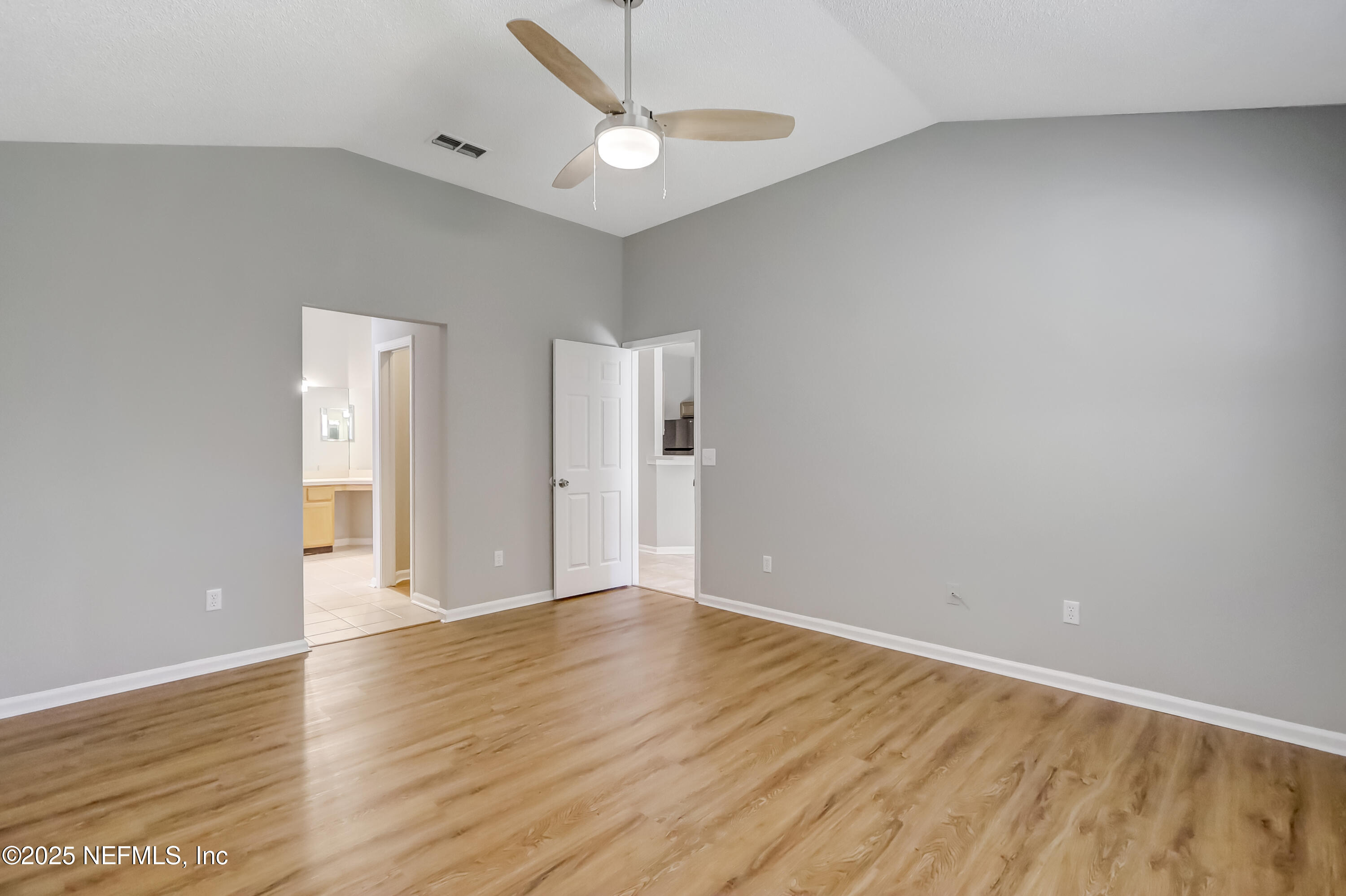 9642 Pritmore Road East Jacksonville, FL 32257 - Photo 10 of 47 wooden floor in an empty room with a window