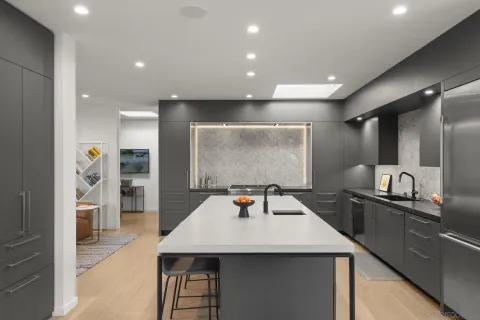 a kitchen with a table and chairs