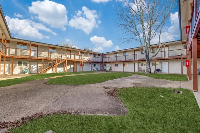 a view of a big building with a big yard