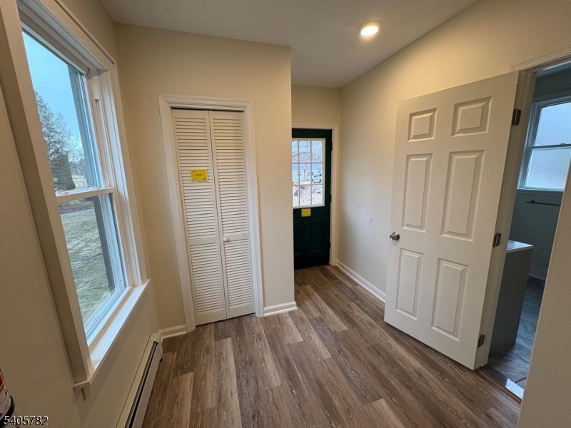 786 South Main Street, Unit 1 Phillipsburg, NJ 08865 - Photo 15 of 18 a view of a hallway with wooden floor and cabinet