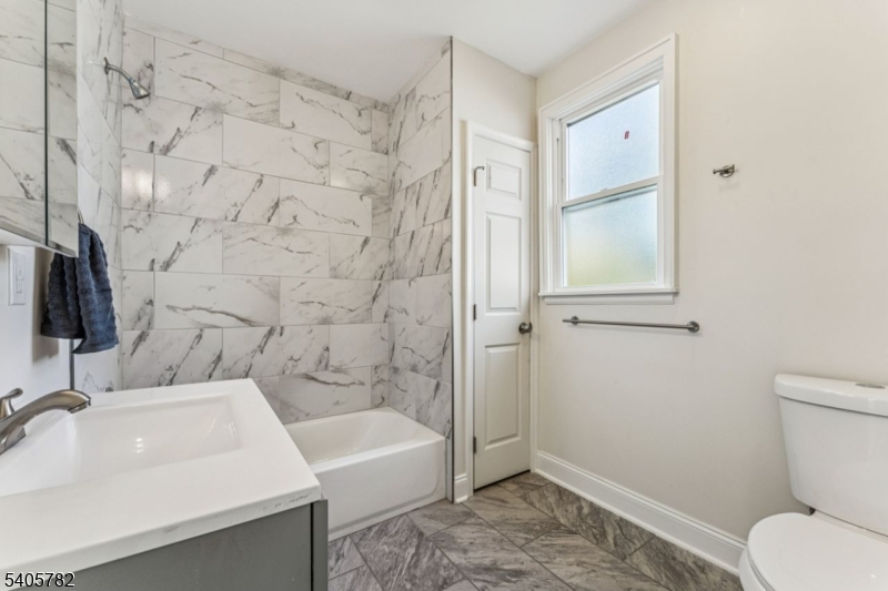 786 South Main Street, Unit 1 Phillipsburg, NJ 08865 - Photo 16 of 18 a bathroom with a sink toilet and shower