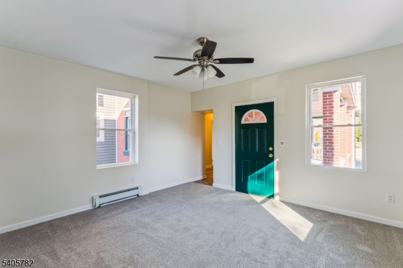 786 South Main Street, Unit 1 Phillipsburg, NJ 08865 - Photo 5 of 18 an empty room with windows and fan