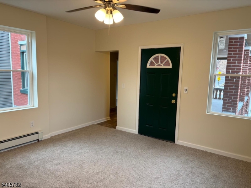 786 South Main Street, Unit 1 Phillipsburg, NJ 08865 - Photo 7 of 18 an empty room with chandelier fan