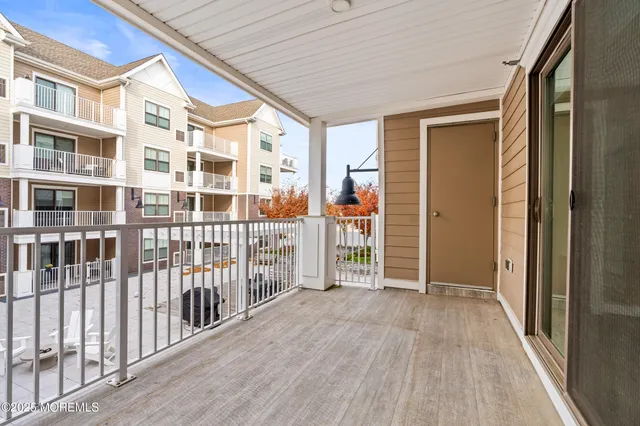 a view of a balcony with wooden floor