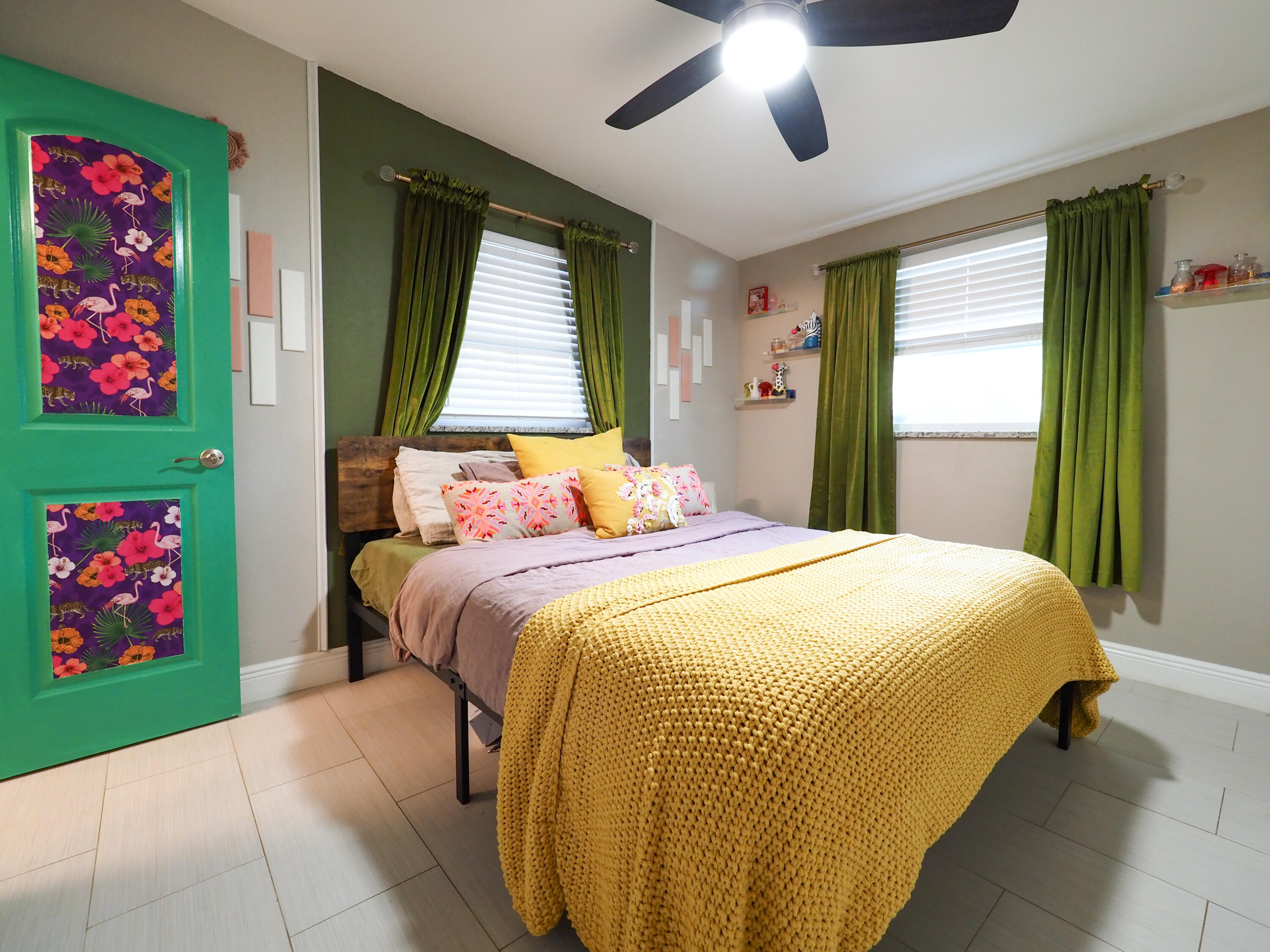 3664 Gull Road Palm Beach Gardens, FL 33410 - Photo 11 of 30 a bedroom with a bed and a chandelier