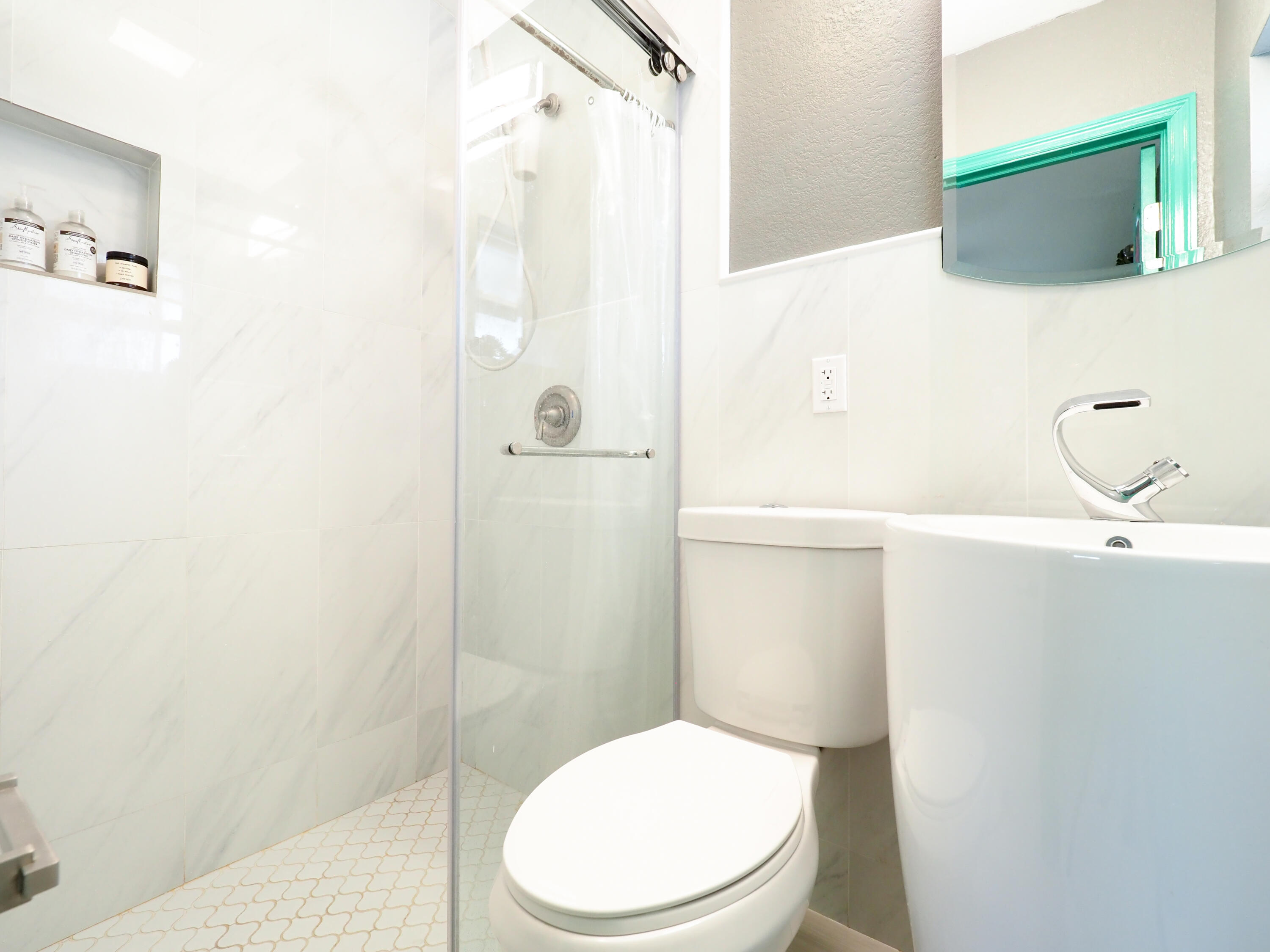 3664 Gull Road Palm Beach Gardens, FL 33410 - Photo 14 of 30 a bathroom with a toilet a sink and shower