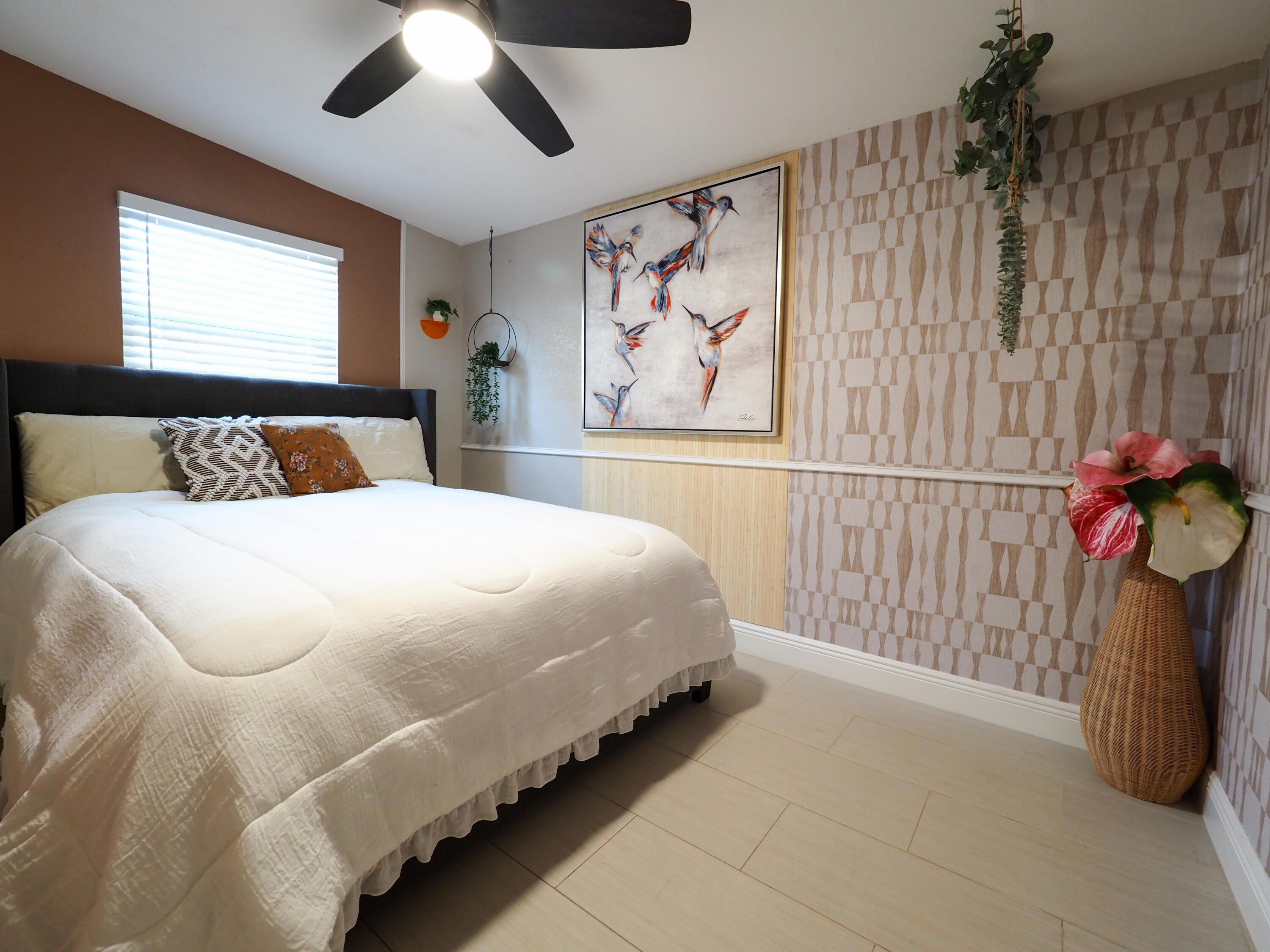 3664 Gull Road Palm Beach Gardens, FL 33410 - Photo 18 of 30 a bedroom with a bed and a chandelier