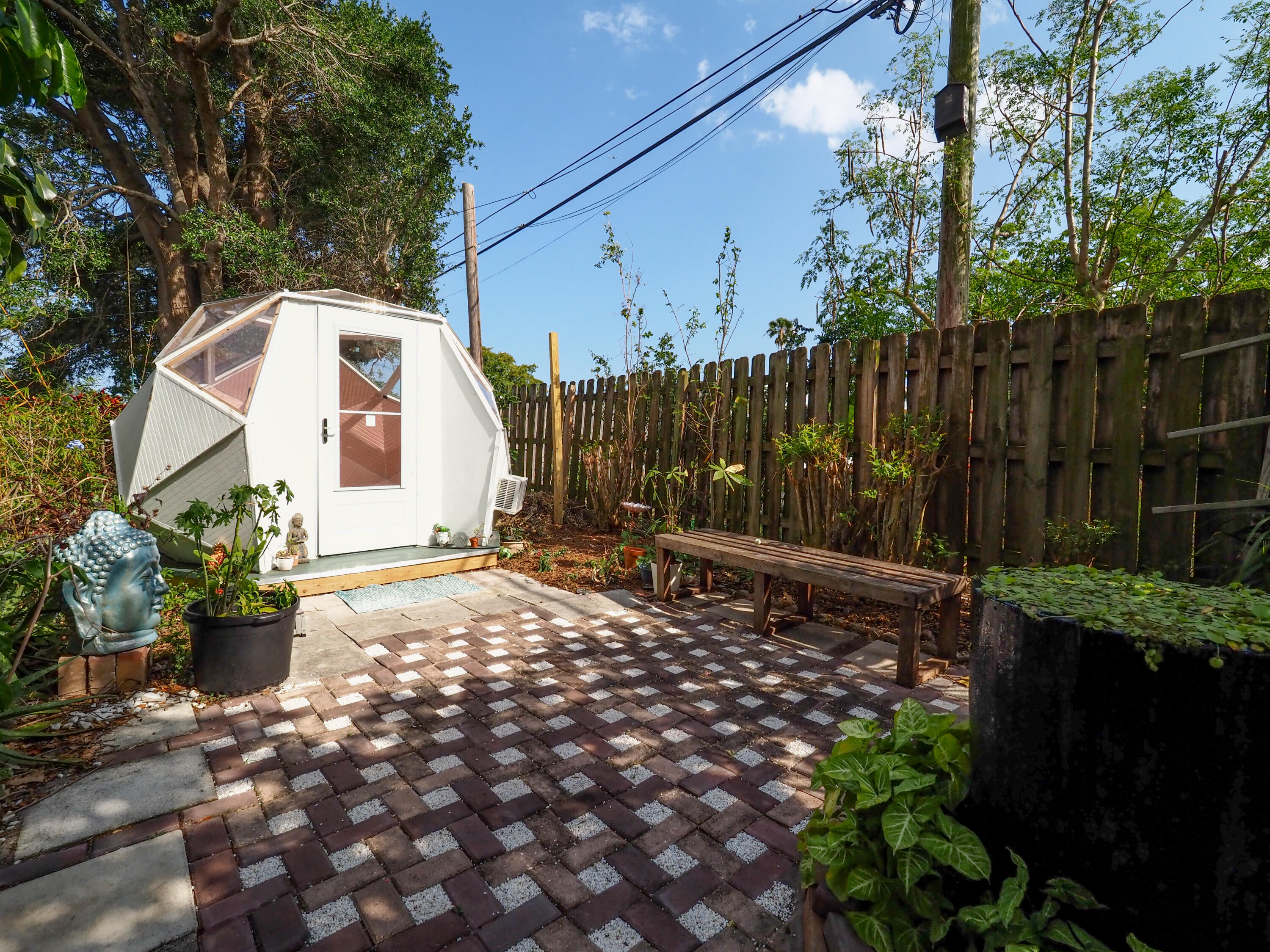 3664 Gull Road Palm Beach Gardens, FL 33410 - Photo 25 of 30 a backyard of a house with lots of green space