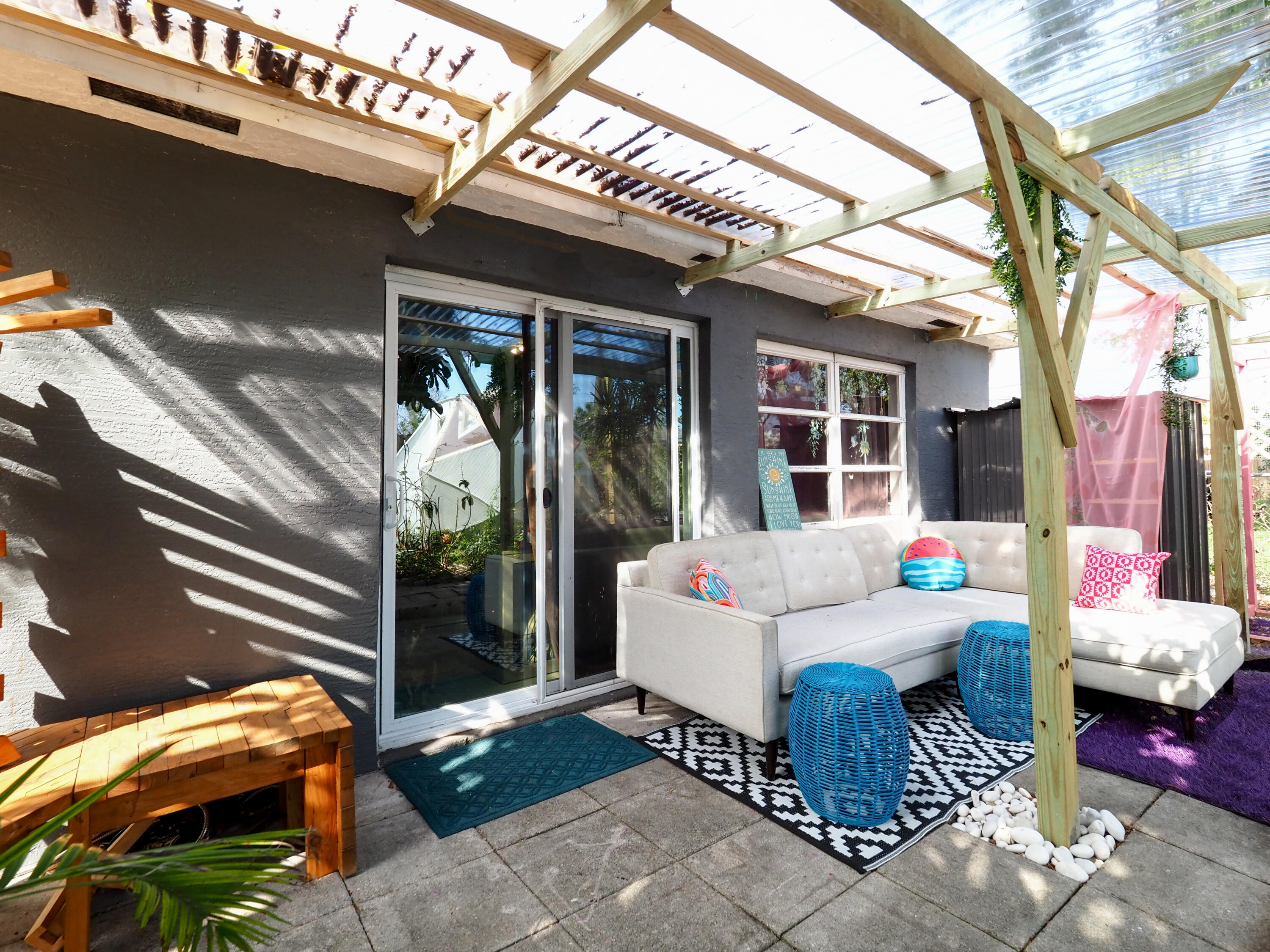 3664 Gull Road Palm Beach Gardens, FL 33410 - Photo 28 of 30 a building outdoor space with patio furniture and potted plants