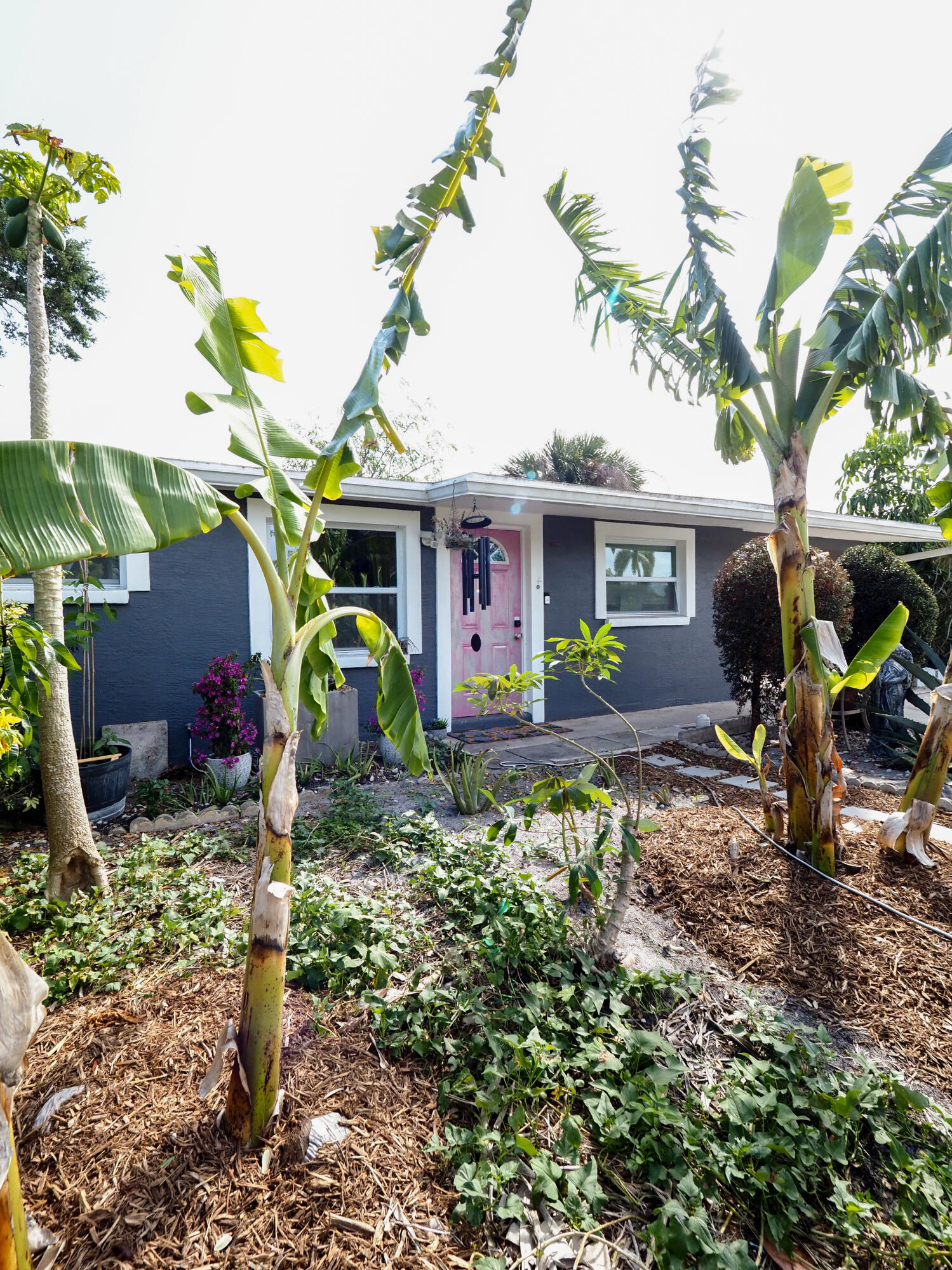 3664 Gull Road Palm Beach Gardens, FL 33410 - Photo 30 of 30 a view of a house with a yard and sitting area