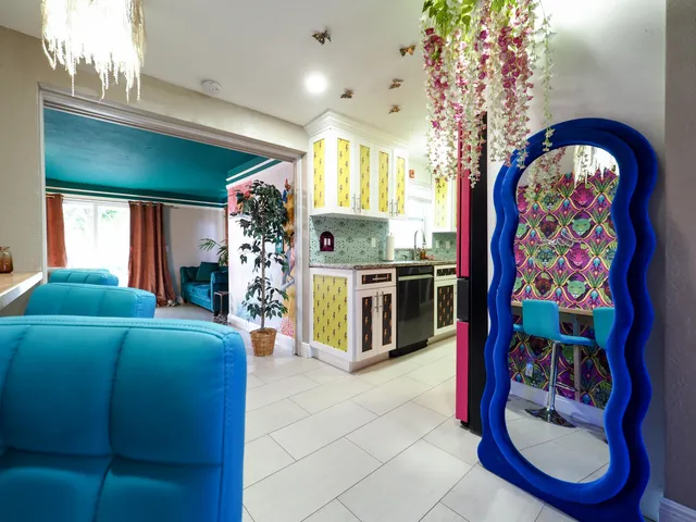 a group of people sitting in front of a store