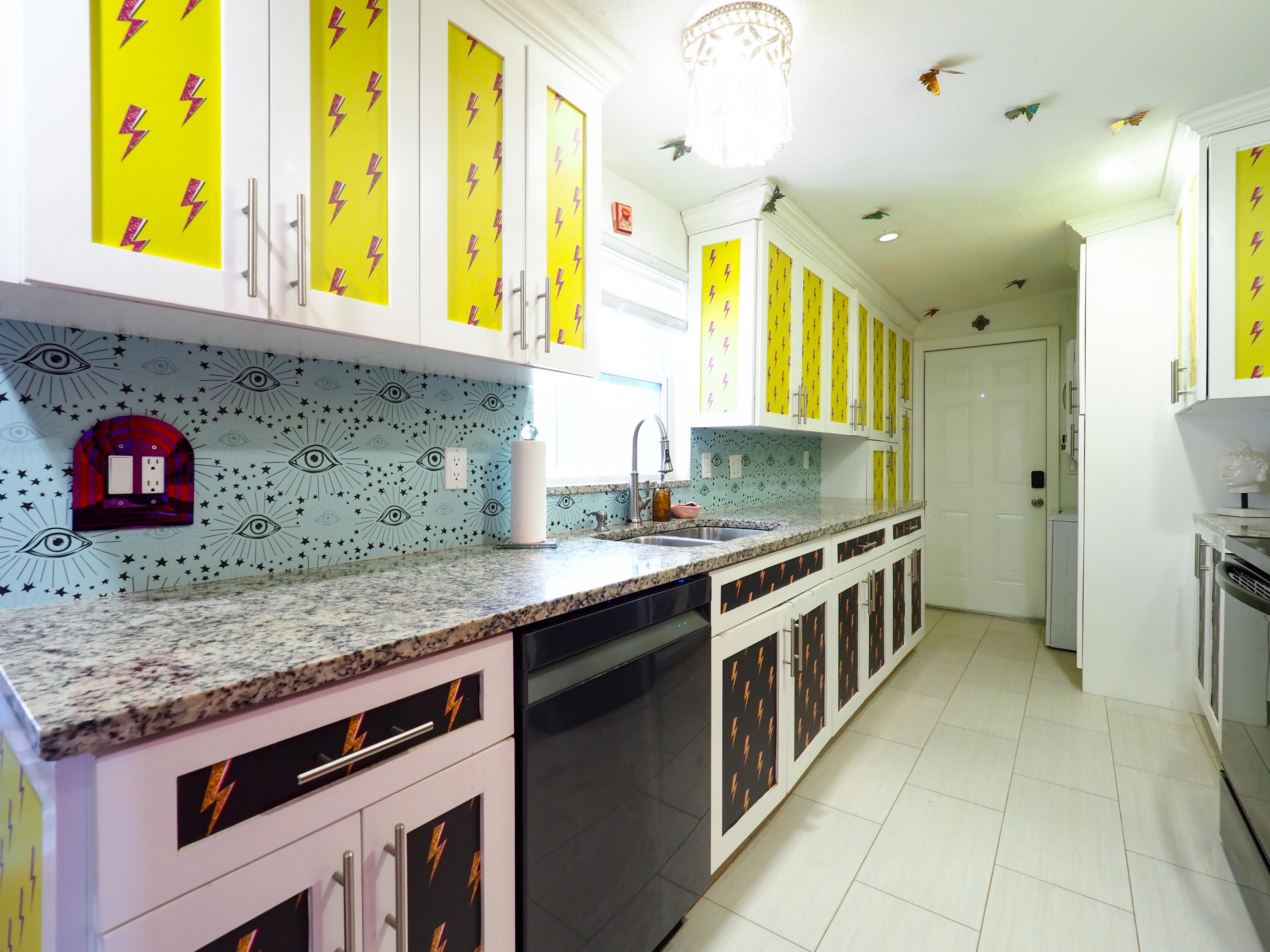 3664 Gull Road Palm Beach Gardens, FL 33410 - Photo 8 of 30 a kitchen with a sink a counter and cabinets