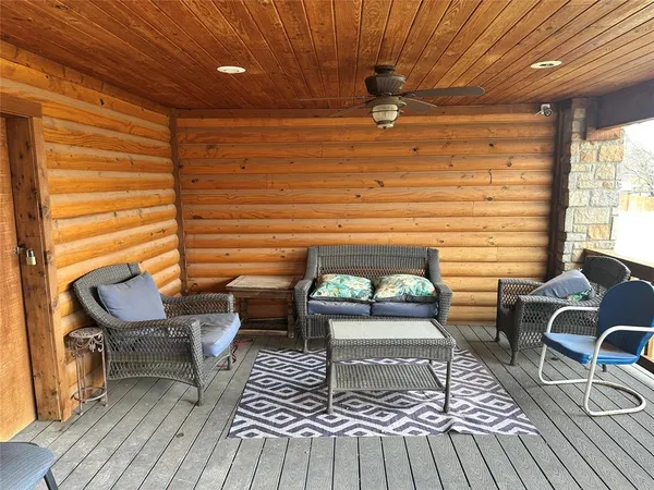 a living room with a couch wooden floor and furniture
