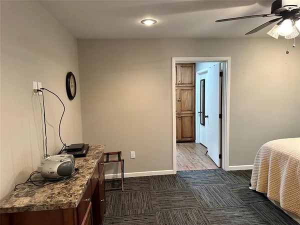 a bedroom with a bed and cabinets