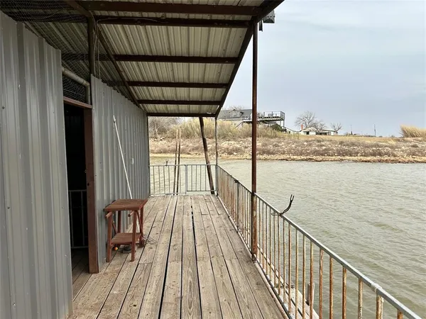 a view of balcony and wooden floor