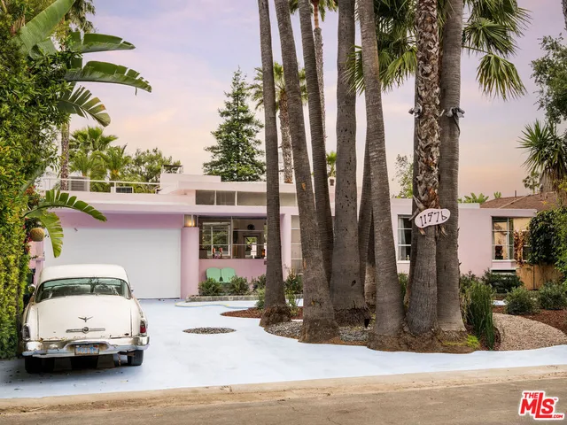 a car parked in front of a house