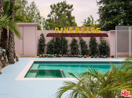 a view of swimming pool with a patio