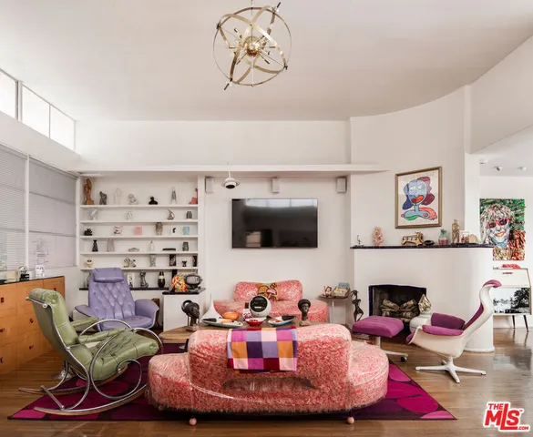 a kitchen with white cabinets and window