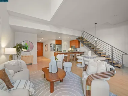 a living room with furniture and a table