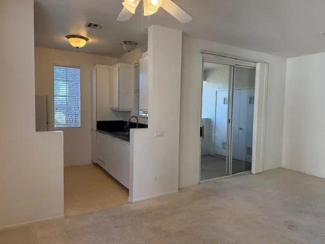 a view of an empty room and window