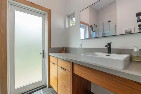a bathroom with a sink and a mirror