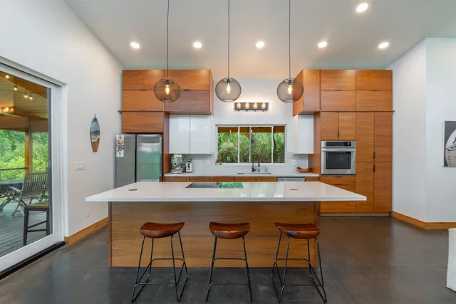 a large kitchen with a table and chairs in it