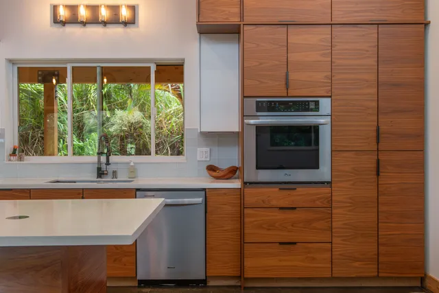 a kitchen with a sink and a window