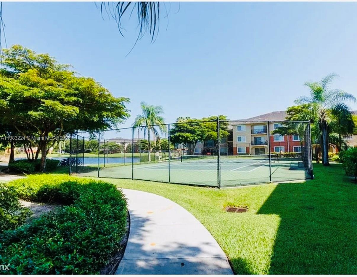 4183 Haverhill Road, Unit 703 West Palm Beach, FL 33417 - Photo 11 of 14 a view of a house with a big yard