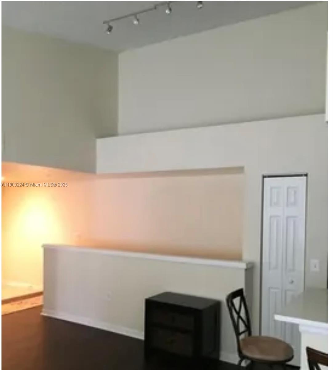 4183 Haverhill Road, Unit 703 West Palm Beach, FL 33417 - Photo 2 of 14 a room with a table and a potted plant