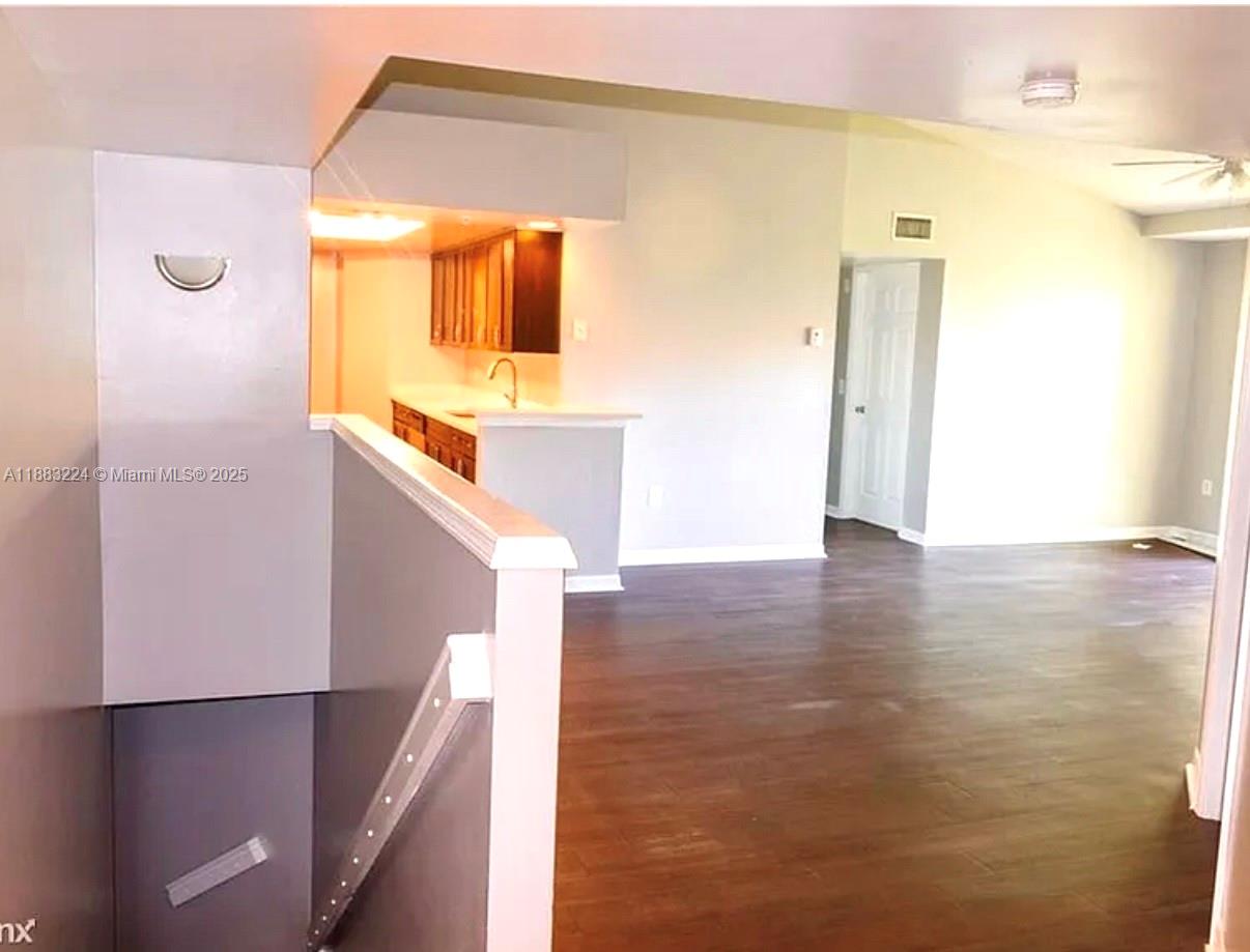 4183 Haverhill Road, Unit 703 West Palm Beach, FL 33417 - Photo 7 of 14 a view of a bathroom from a hallway