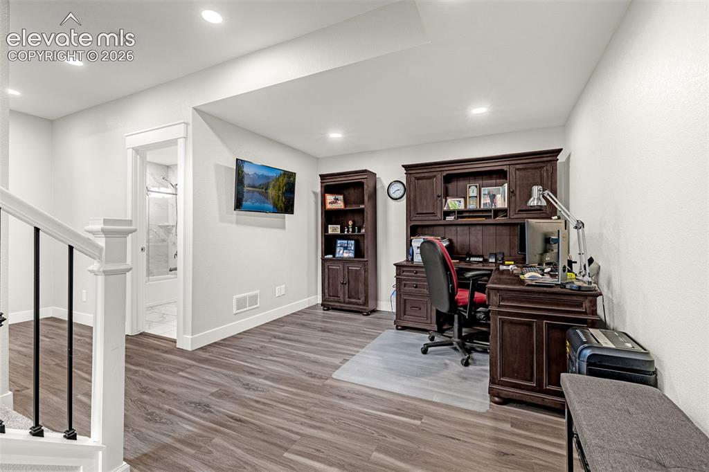 260 Eagle Summit Point, Unit 101 Colorado Springs, CO 80919 - Photo 12 of 33 Finished basement, living area, full bathroom and 1 bedroom.