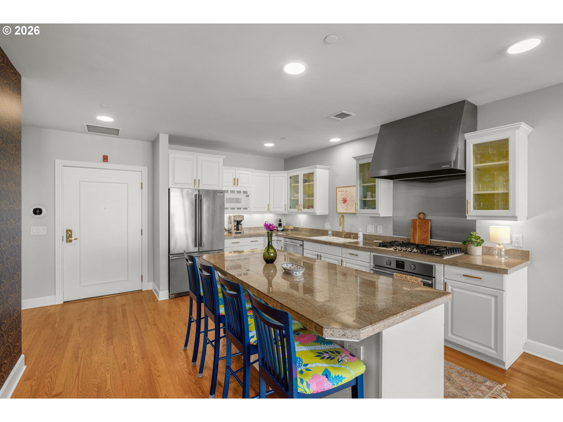 2020 Southwest Market St Drive, Unit 303 Portland, OR 97201 - Photo 11 of 31 a kitchen with stainless steel appliances granite countertop a sink a stove and refrigerator