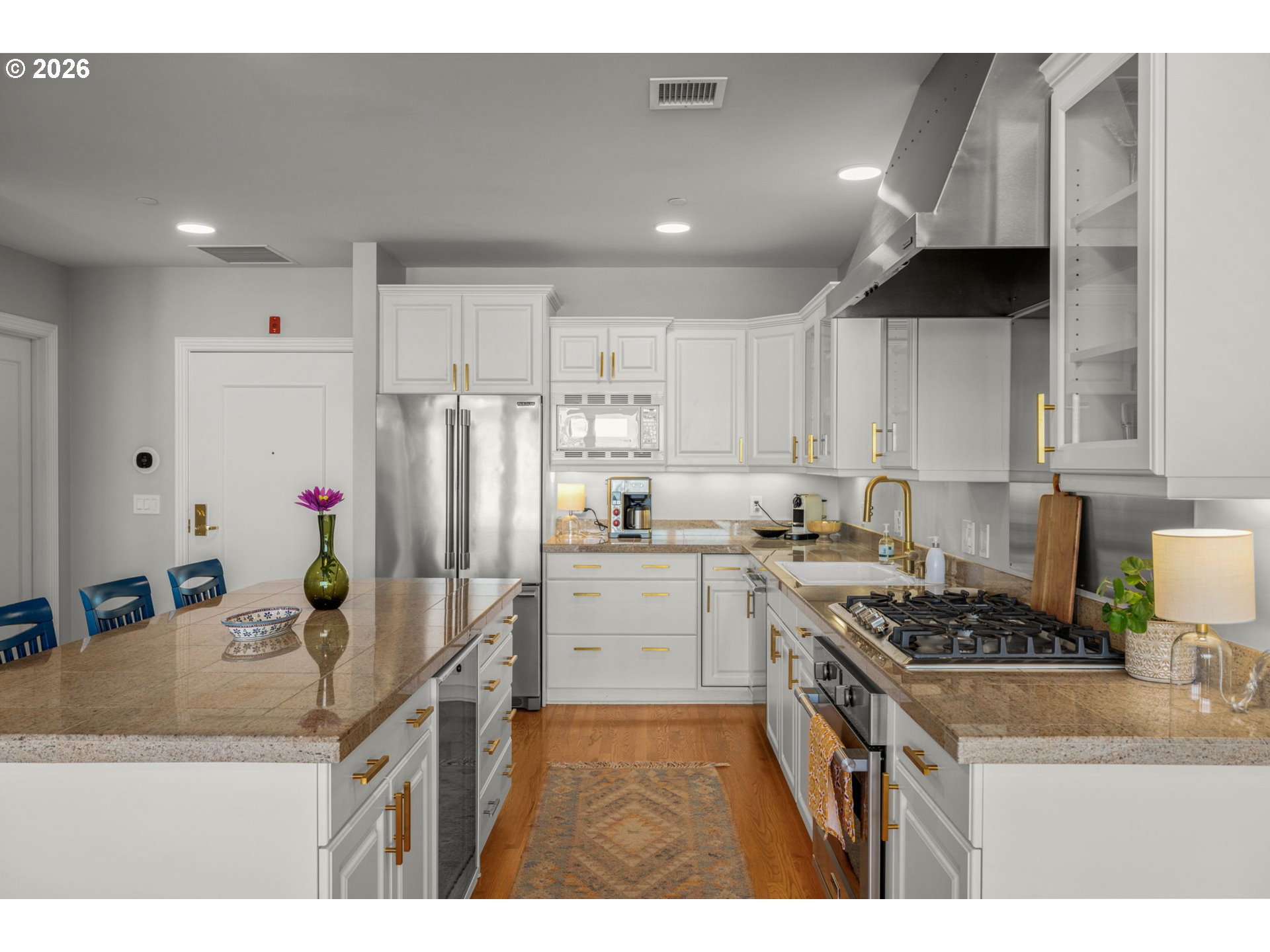 2020 Southwest Market St Drive, Unit 303 Portland, OR 97201 - Photo 14 of 31 a kitchen that has a lot of cabinets a sink and appliances