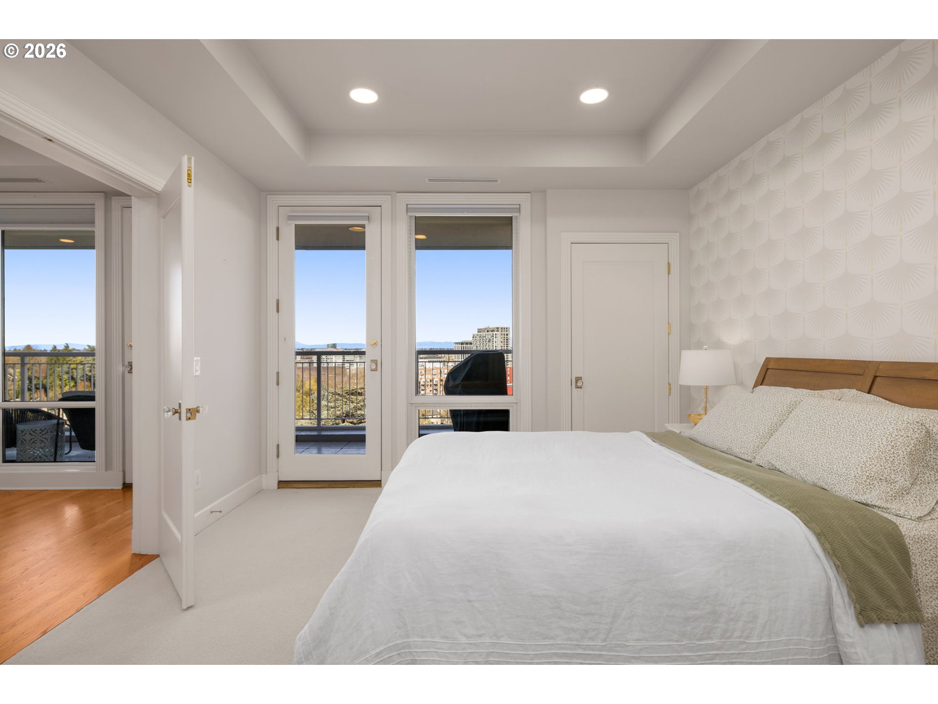 2020 Southwest Market St Drive, Unit 303 Portland, OR 97201 - Photo 22 of 31 a bedroom with a bed and a view of living room