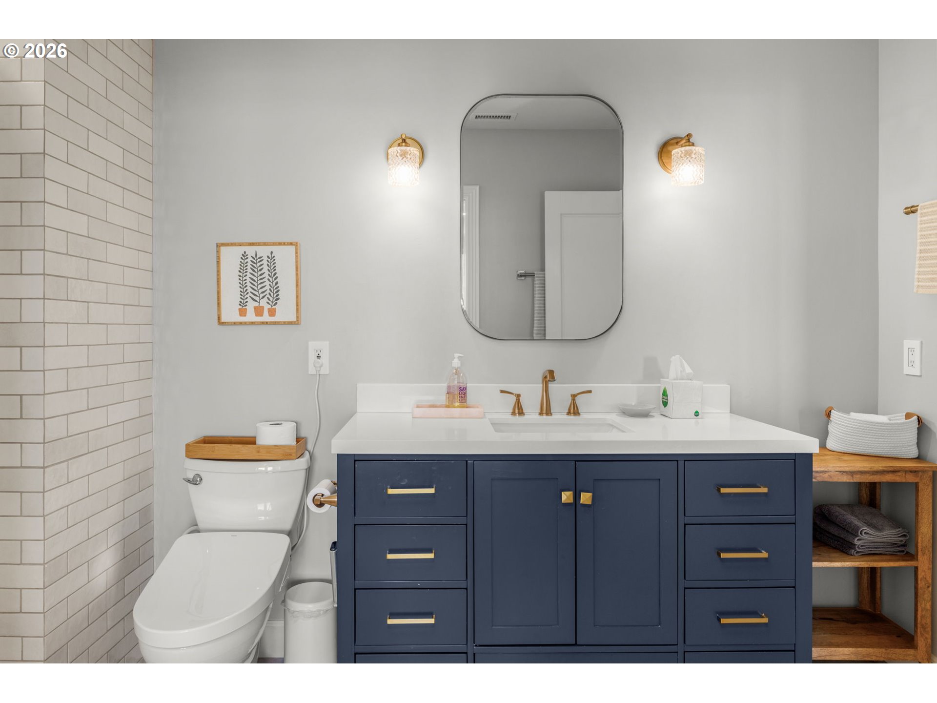 2020 Southwest Market St Drive, Unit 303 Portland, OR 97201 - Photo 25 of 31 a bathroom with a toilet sink and mirror