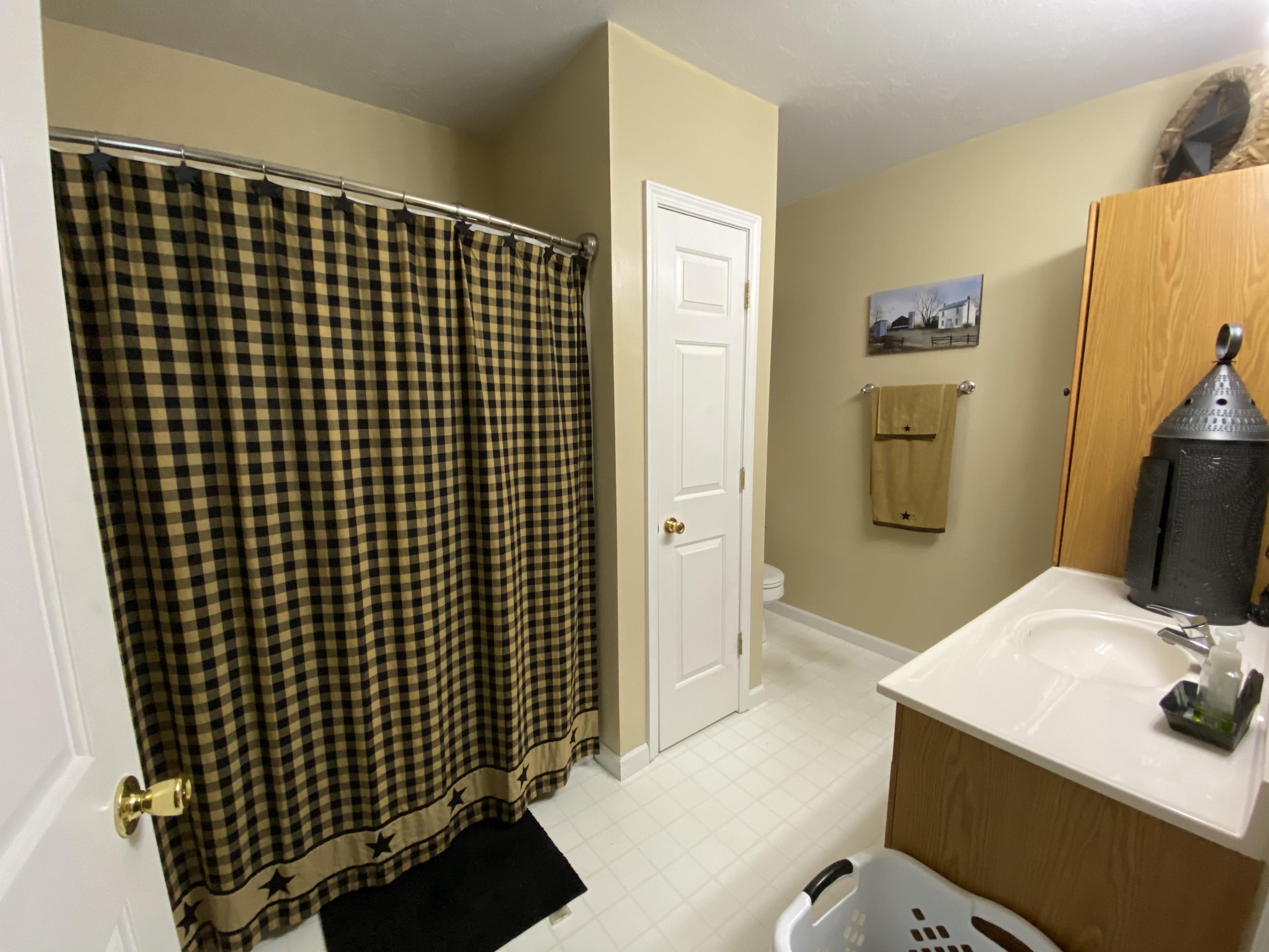2211 Riner Road Christiansburg, VA 24073 - Photo 12 of 15 a bathroom with a sink and a mirror