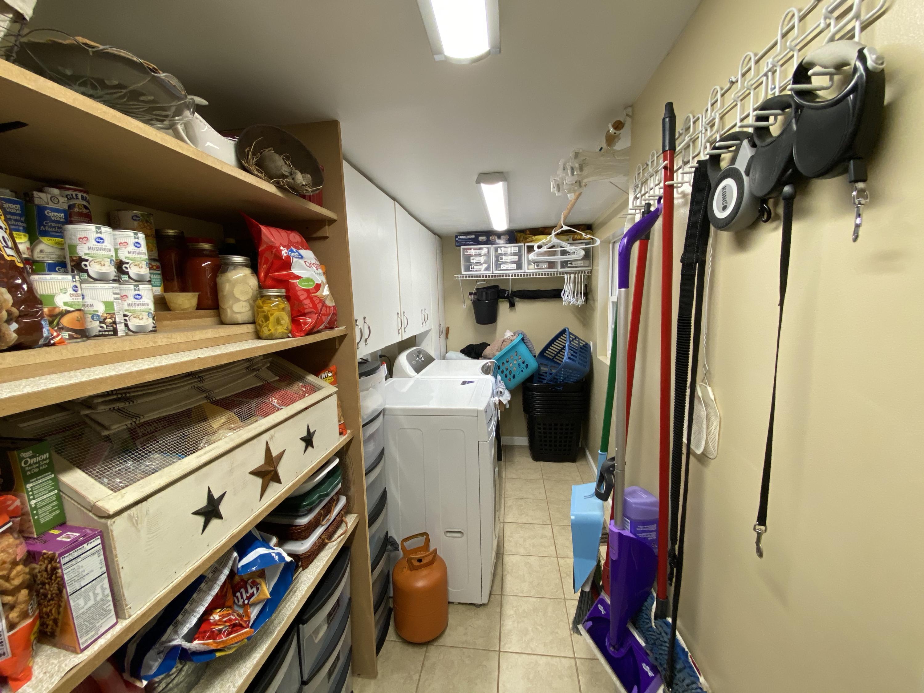 2211 Riner Road Christiansburg, VA 24073 - Photo 14 of 15 a view of walk in closet with clothes and shoes