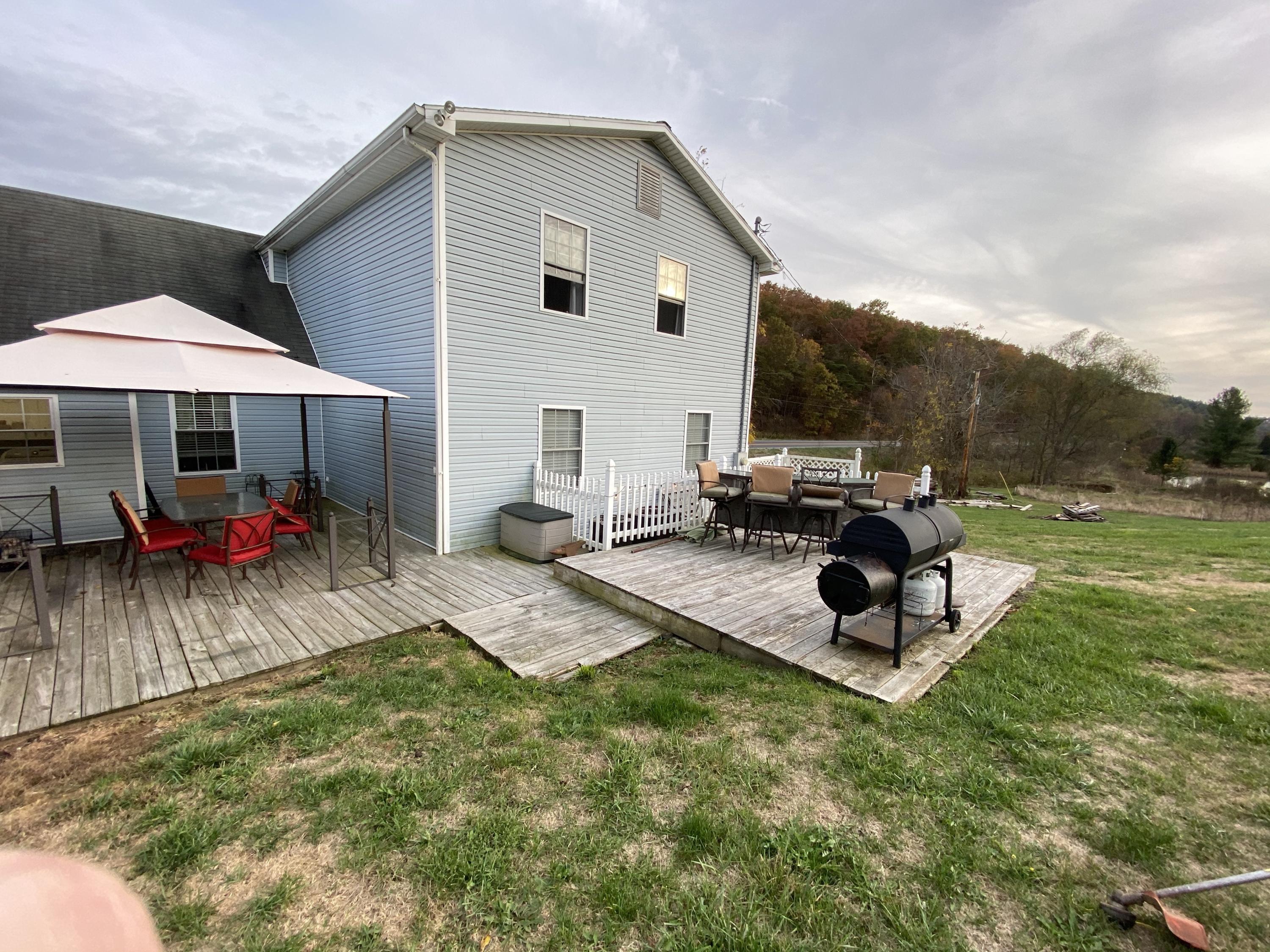 2211 Riner Road Christiansburg, VA 24073 - Photo 15 of 15 a view of a backyard with sitting area and furniture