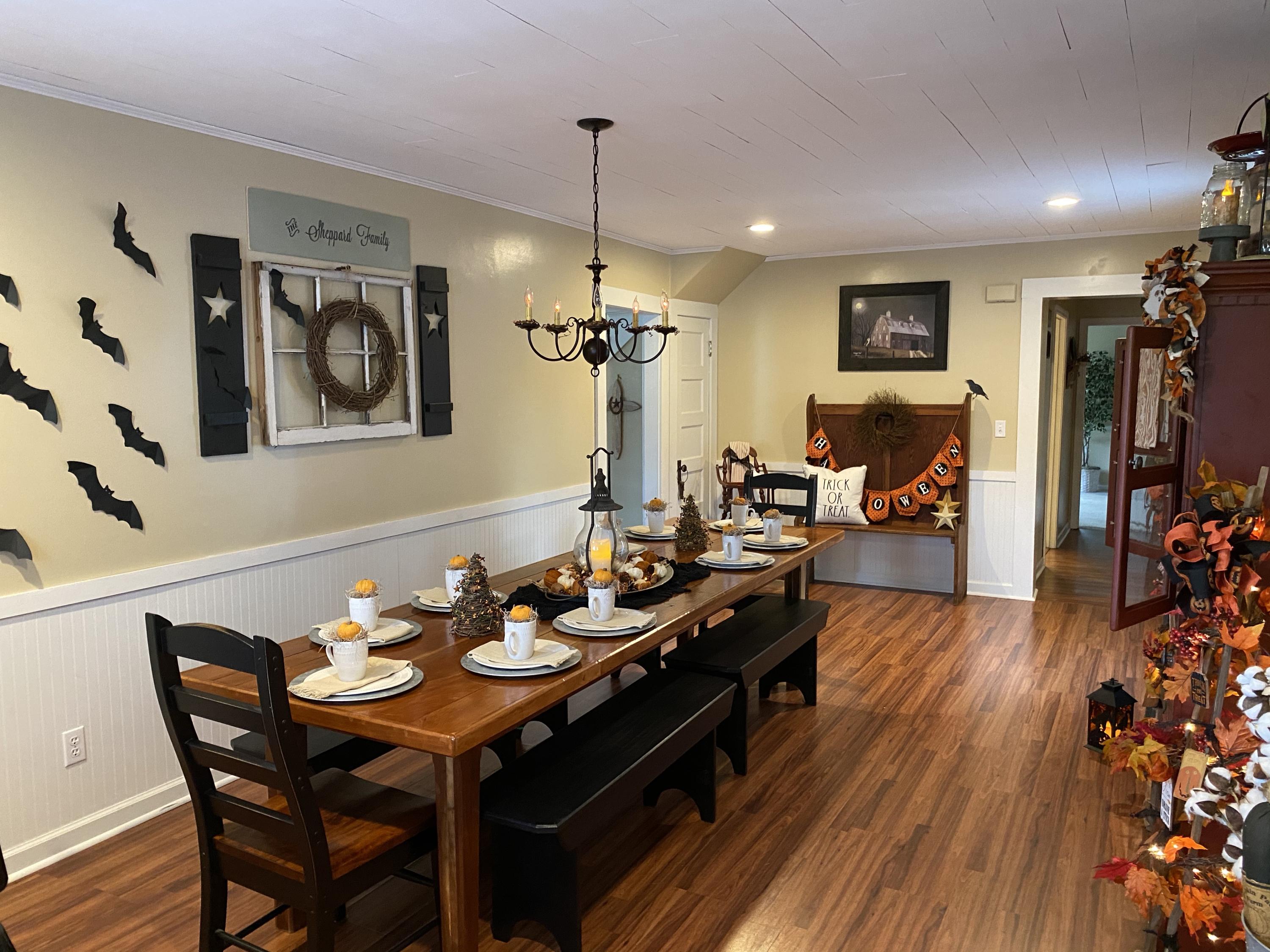 2211 Riner Road Christiansburg, VA 24073 - Photo 4 of 15 a view of a a dining room and livingroom with furniture wooden floor a chandelier