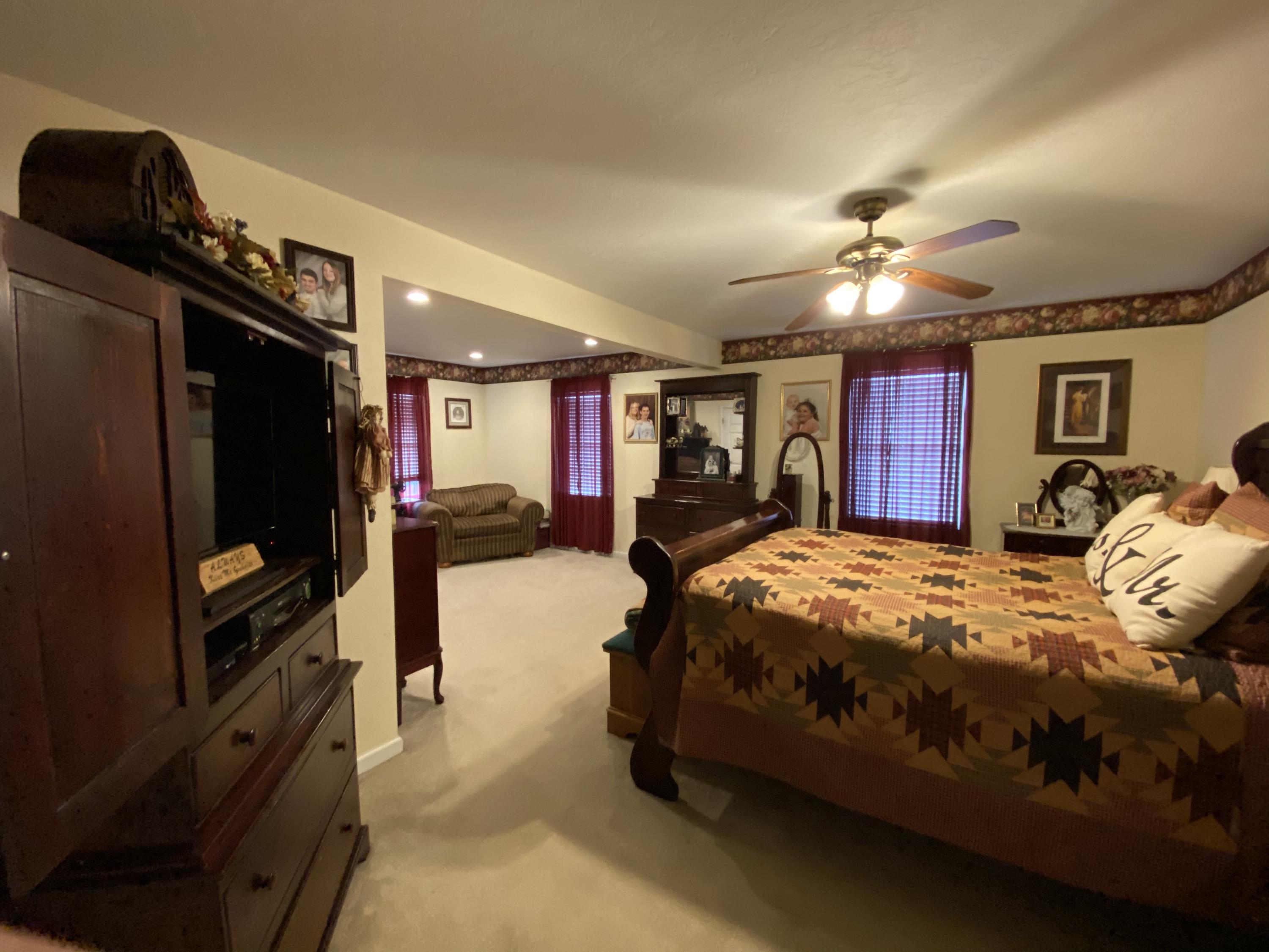 2211 Riner Road Christiansburg, VA 24073 - Photo 8 of 15 a bed room with a bed window and dresser