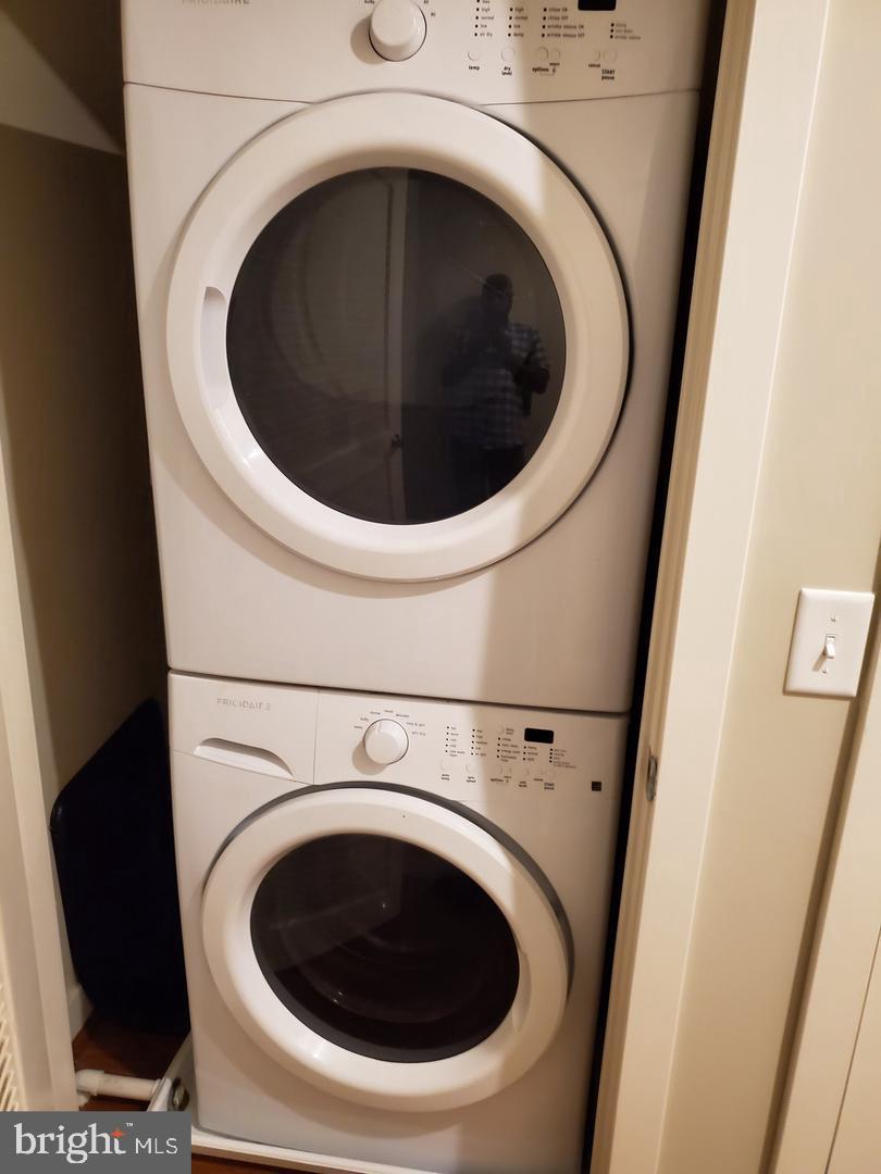 1320 Fenwick Lane, Unit 700 Silver Spring, MD 20910 - Photo 11 of 11 a utility room with dryer and washer