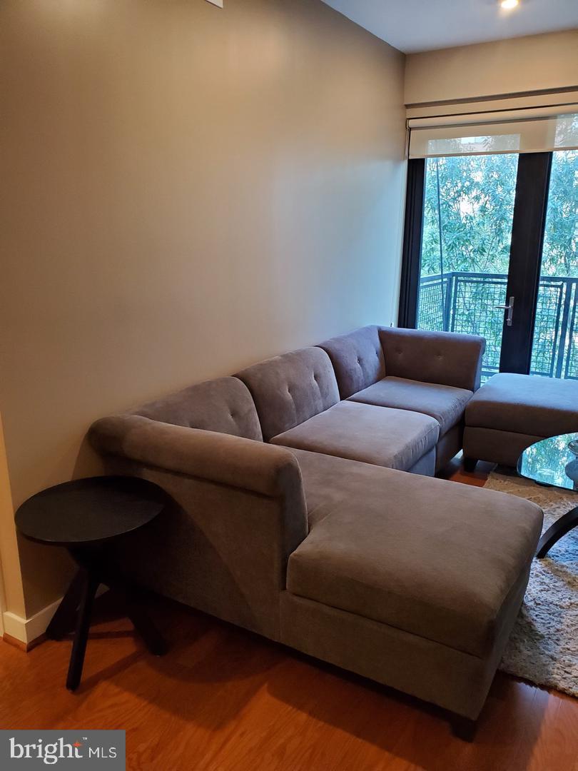 1320 Fenwick Lane, Unit 700 Silver Spring, MD 20910 - Photo 3 of 11 a living room with furniture and a window